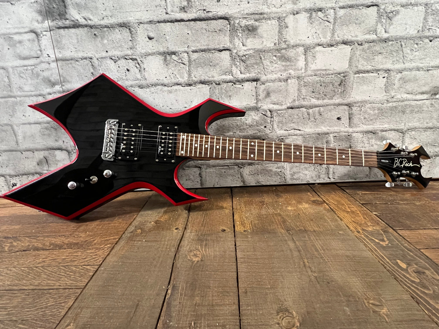 Used B.C. Rich Warlock w/ Red Bevels